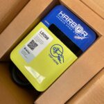 FanAtlas charger in a box, labeled with a QR code and 