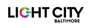 Light City Baltimore logo with "LIGHT CITY" in bold black text; the "G" is multicolored, and "BALTIMORE" appears below in smaller black letters.