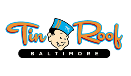 Logo for Tin Roof Baltimore featuring stylized orange and blue text with a cartoon man's face wearing a blue hat showing the initials "TR.